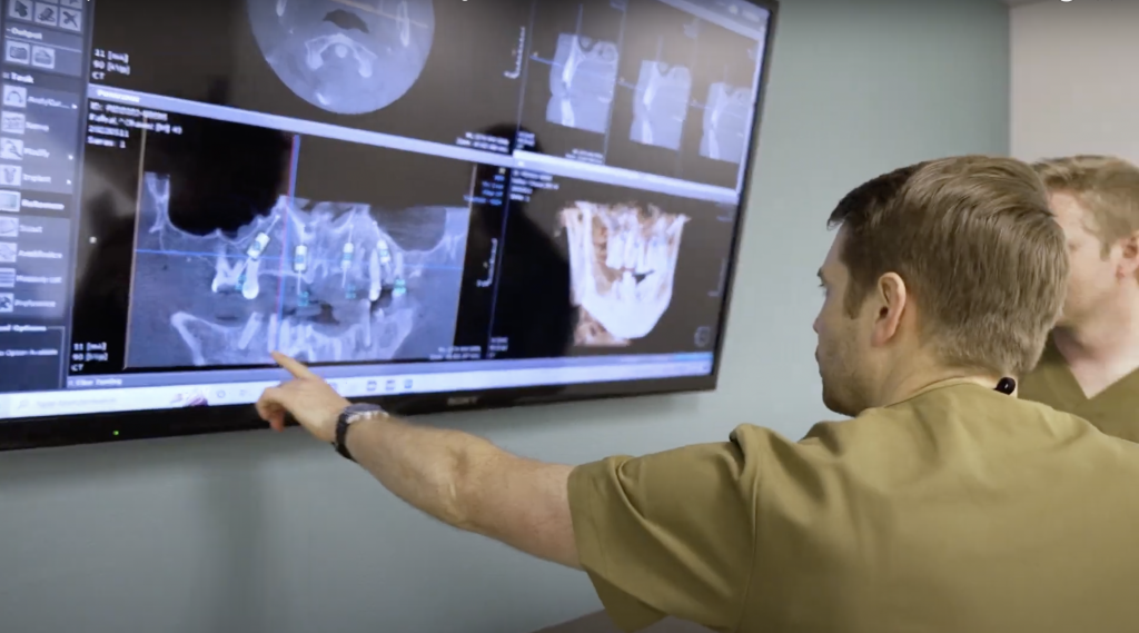 Dentist looking at Xrays